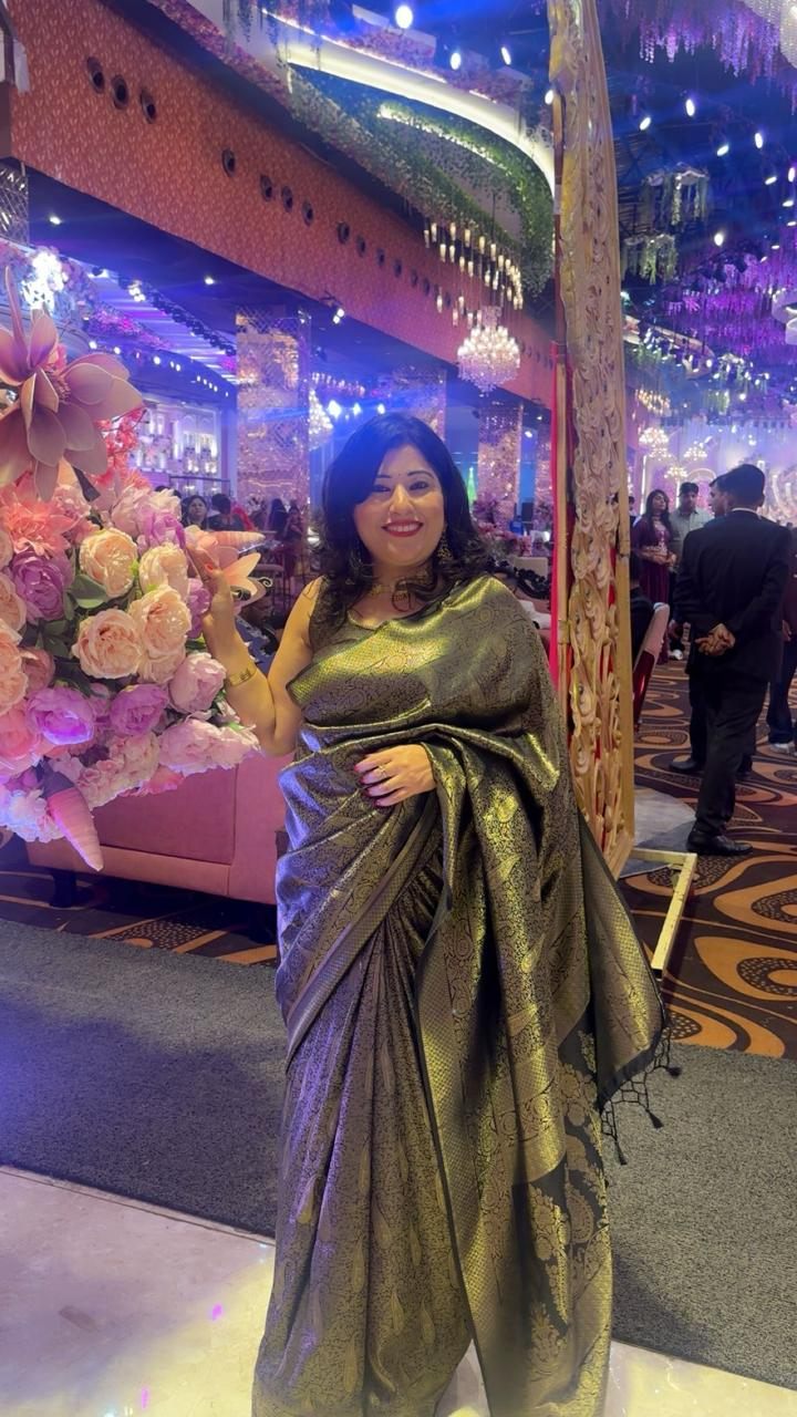Black and gold Banarasi silk saree worn at a wedding