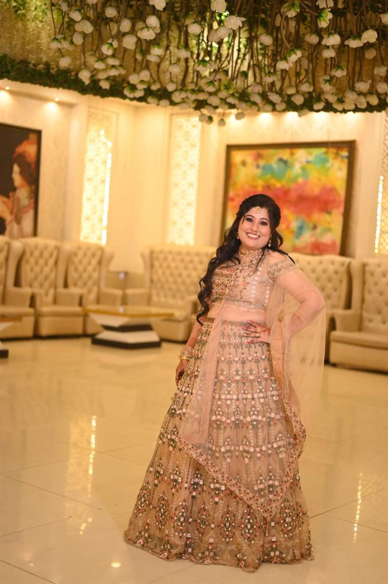 Champagne bridal lehenga with floral embroidery